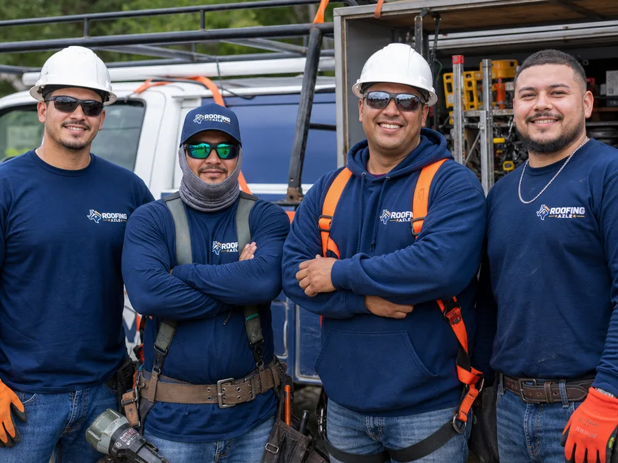 Roofing Azle crew beside an organized work truck wearing roofing safety gear